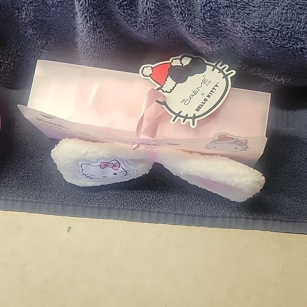 Hello Kitty Pink Plush Slippers and Headband Set. Skippers are size 7/8.